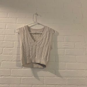 we are selling a white sweater vest originally from jacks surf shop